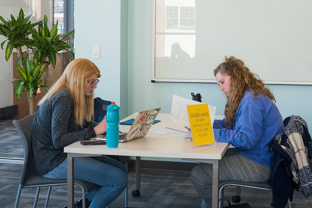 Two students study in the student academic success center